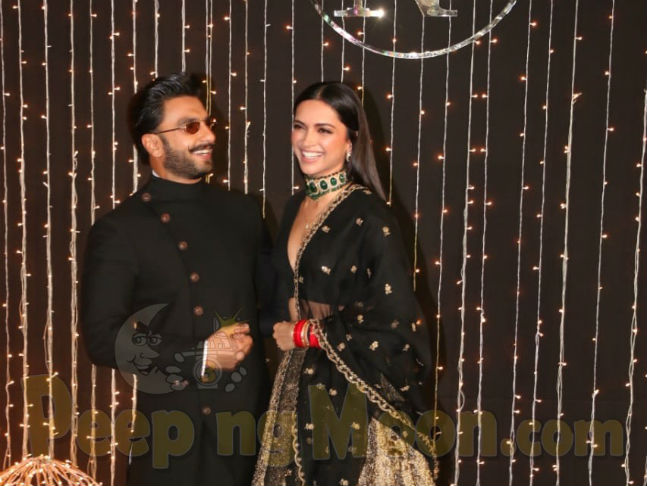 Ranveer Singh holds wife Deepika Padukone's heels at a wedding